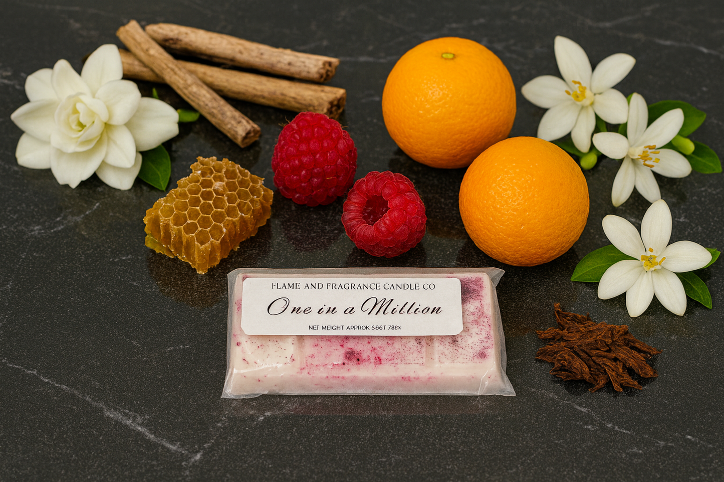 Wax melt bar labelled 'One in a Million' surrounded by fruits, flowers, and spices on a dark surface