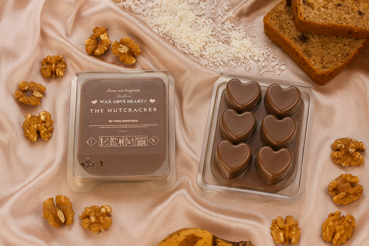 Nut coloured wax hearts in a mold with packaging and walnuts on a textured surface