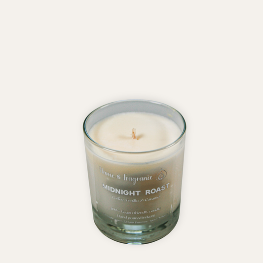 Candle in a glass jar labeled 'Midnight Roast' on a light gray background