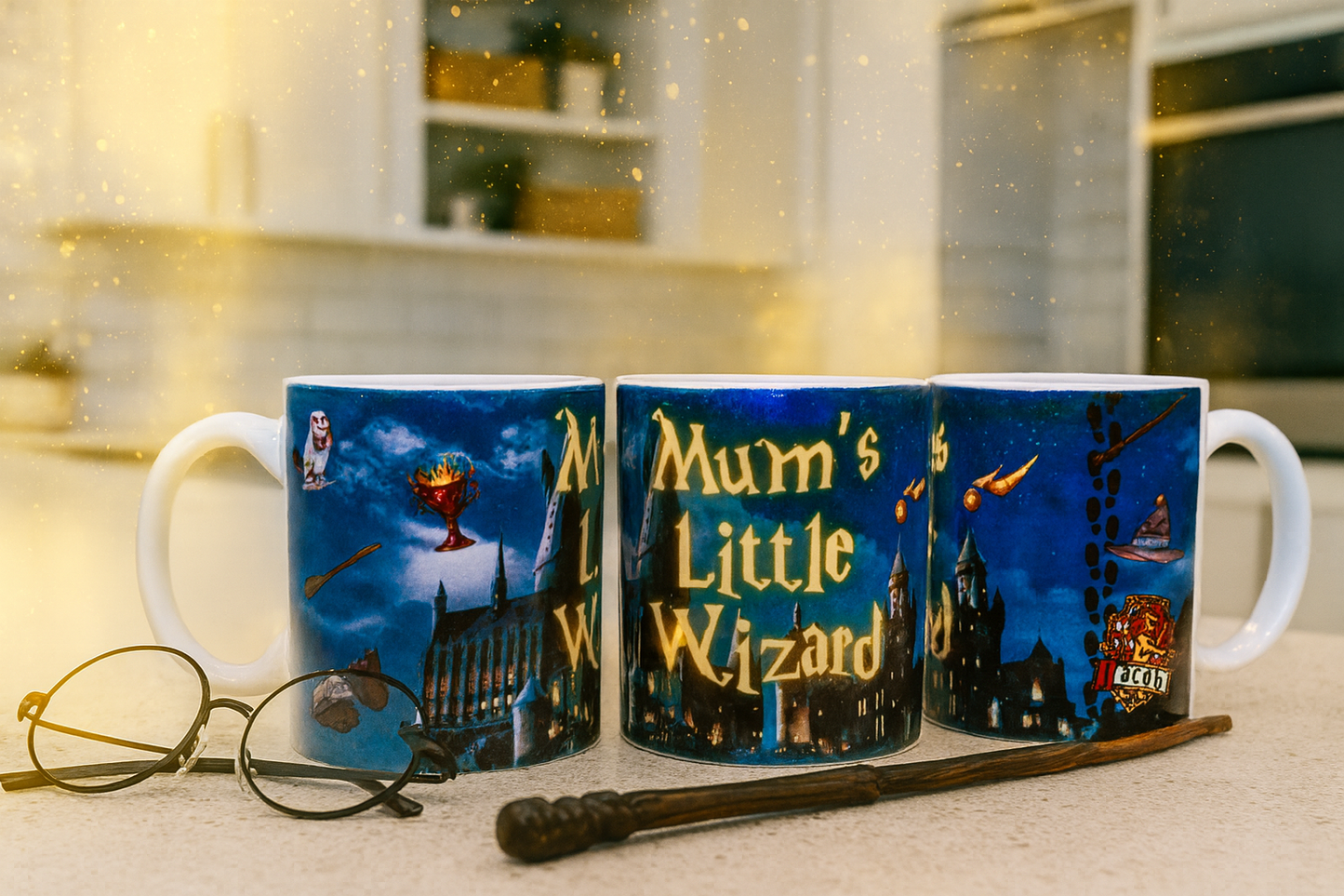 A Harry Potter-style mug with a 'Mum's Little Wizard' slogan and a personalised child's name on a kitchen surface, with glasses and a wand.