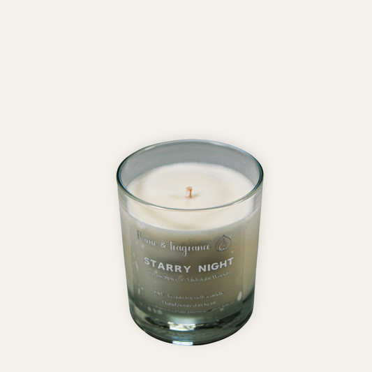 Starry Night candle in a glass container on a white background