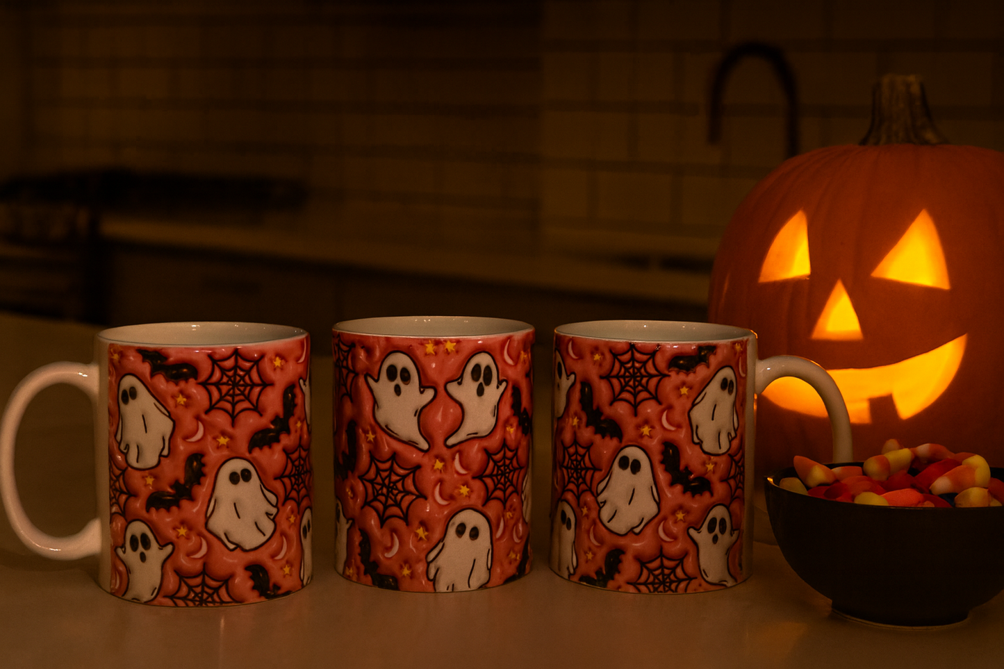 Coffee mug from three perspectives showing Halloween-themed design with ghost and spider designs next to a lit jack-o'-lantern.