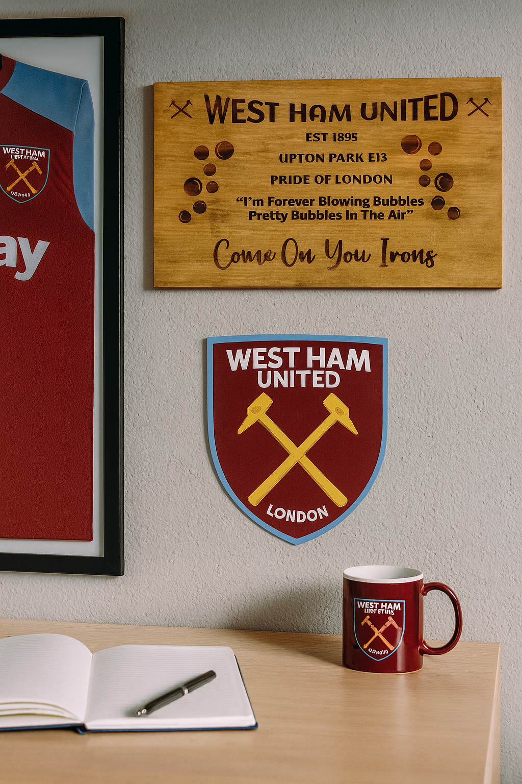 West Ham United themed decor including a mug, plaque, and shirt on a wall.
